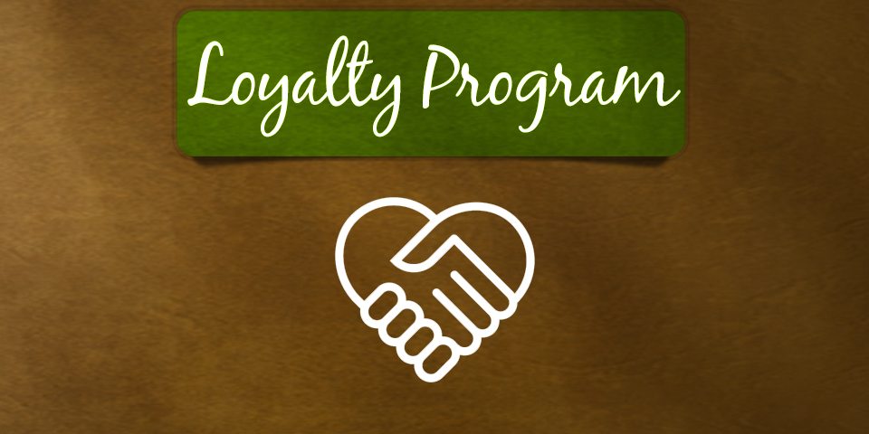 hands holding each other to form a heart with the words "loyalty program"