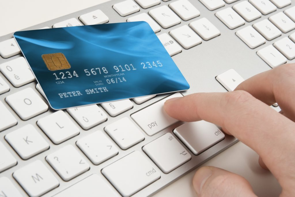 Payment Systems - credit card sitting on a keyboard