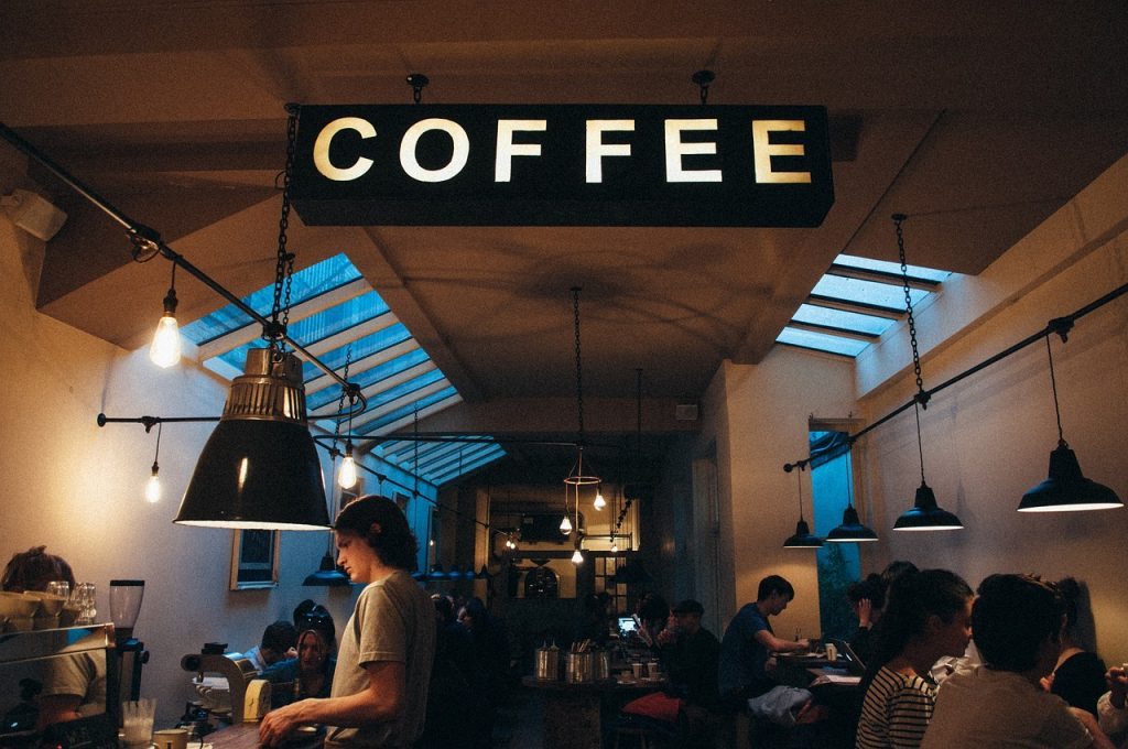 Point of Sale - many people in an urban, minimalist coffee shop